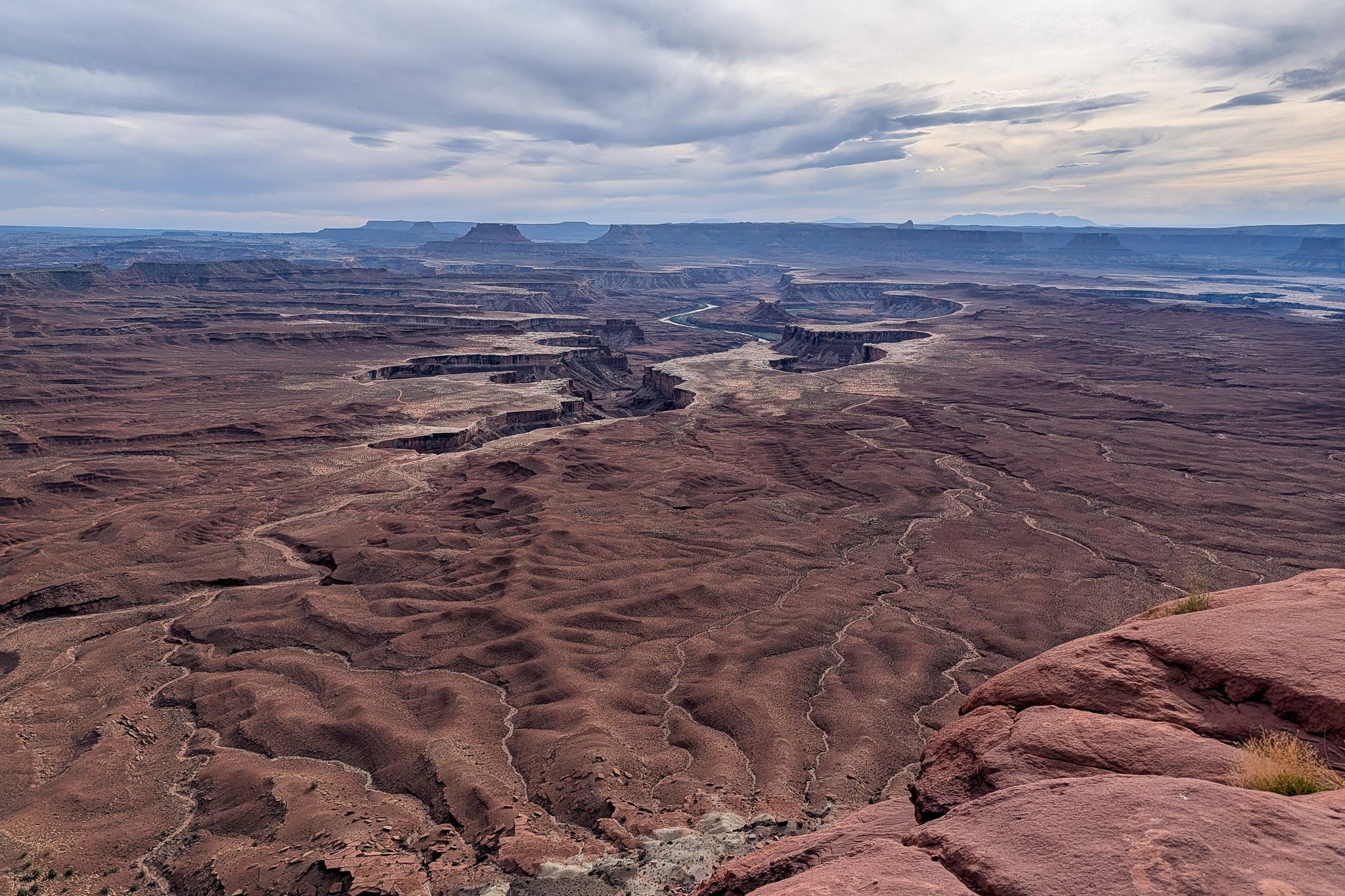 Green River cloudy canyon vista with rim rocks